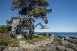 The rocky coastline on which the house sits.